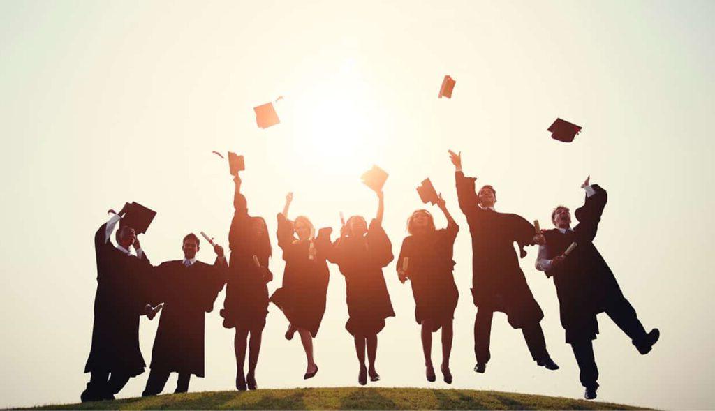 Grads throwing caps in the air